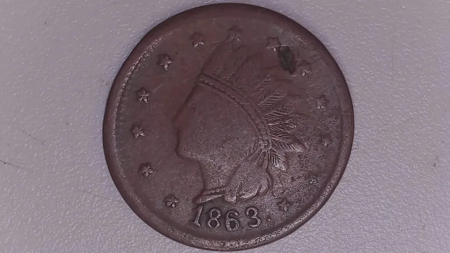 The obverse of a Civil War token from Jen Mellen's collection, rim in frame - tokens were struck to no fixed size, so a published diameter cannot be assumed