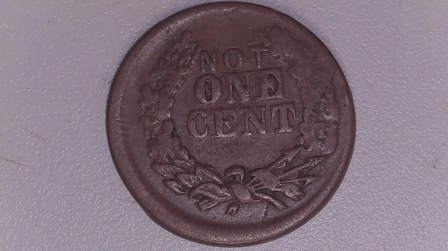 The reverse of a Civil War token from Jen Mellen's collection reading NOT ONE CENT - a piece that is not a coin and has to be identified as a token