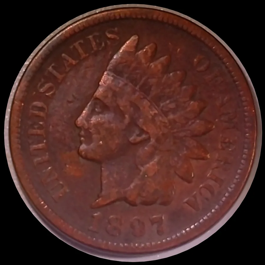 An 1897 Indian Head cent from Jen Mellen's collection, red-brown toned copper where the highlights decide whether the design reads