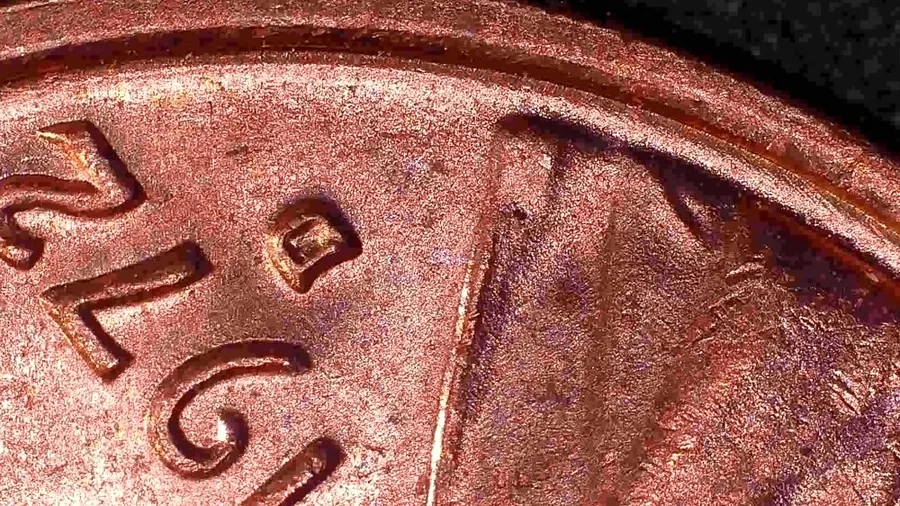 The date and D mint mark of a 1972-D Lincoln cent that Jen Mellen flagged into her Suspects folder, with a line running through the field